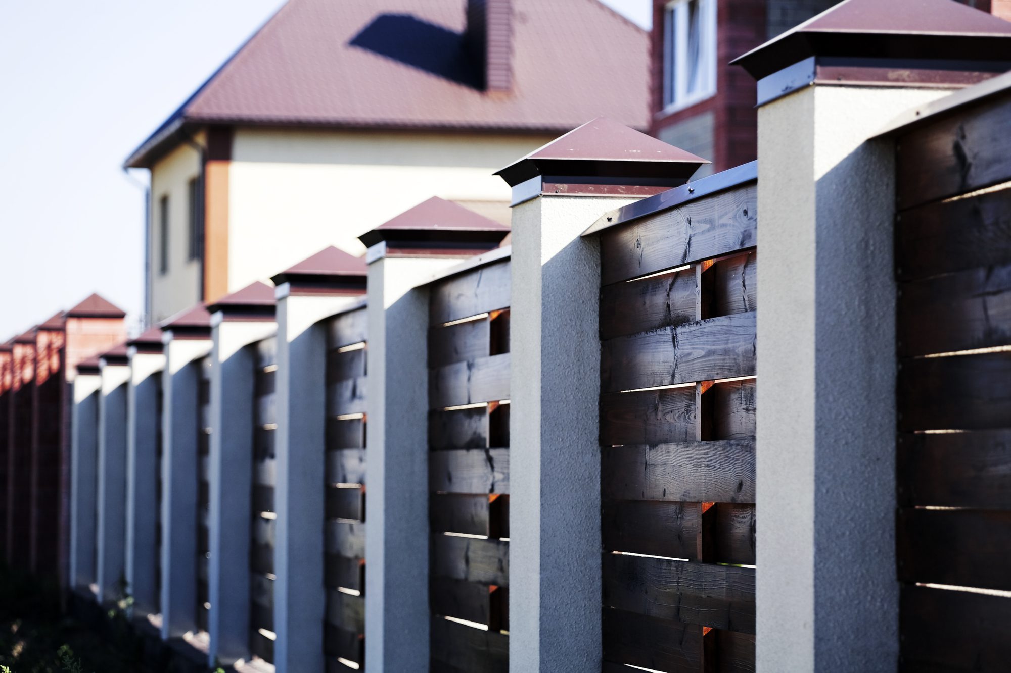 fence and the modern house in suburban settlement